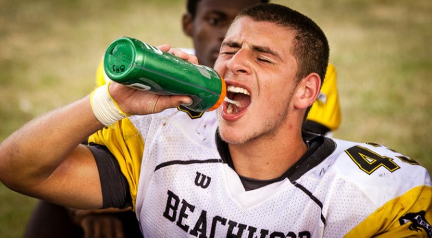 football players drinking gatorade