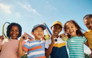 image of children athletes smiling together